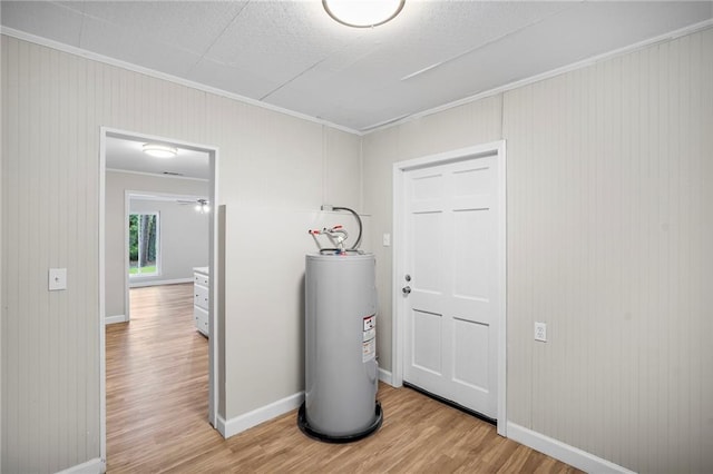 utility room featuring electric water heater