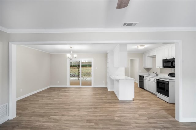 kitchen with white cabinetry, sink, black appliances, light hardwood / wood-style flooring, and crown molding