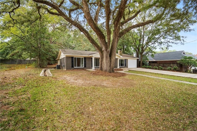 view of front of house with a front lawn and a garage