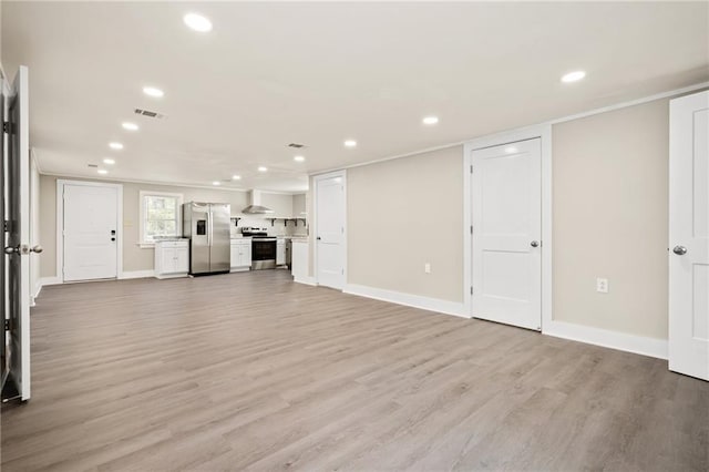 unfurnished living room with light hardwood / wood-style floors