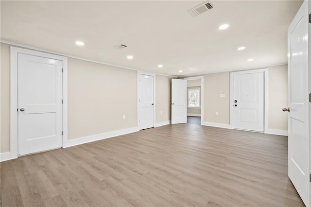 spare room with light hardwood / wood-style floors