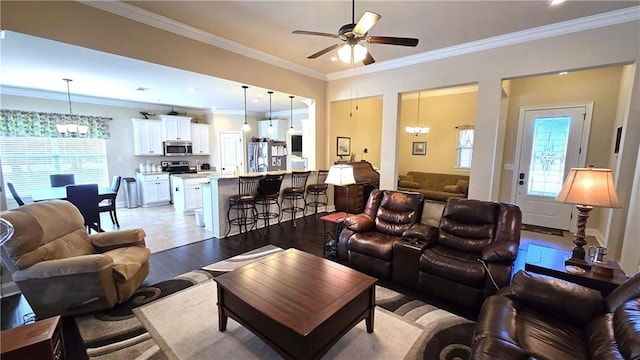 1109 Orlando Dr, Foley, AL 36535 - living room featuring a chandelier, ceiling fan, crown molding, and light wood finished floors