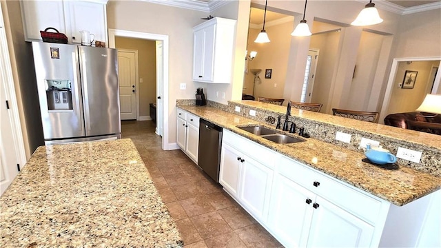 1109 Orlando Dr, Foley, AL 36535 - kitchen with stainless steel appliances, a sink, crown molding, white cabinetry, and light stone counters