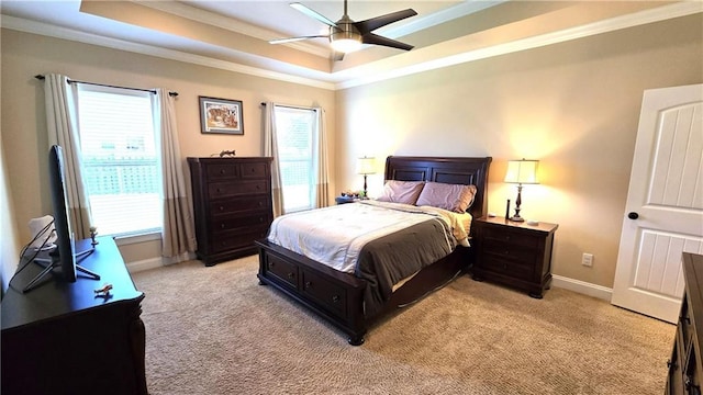 1109 Orlando Dr, Foley, AL 36535 - bedroom featuring a raised ceiling, crown molding, light carpet, baseboards, and a ceiling fan