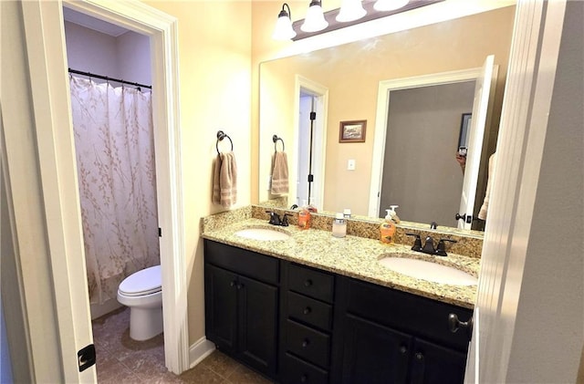 1109 Orlando Dr, Foley, AL 36535 - full bath featuring double vanity, toilet, and tile patterned floors