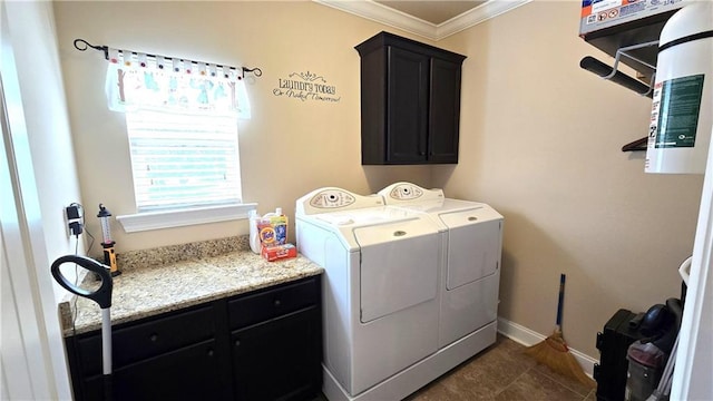 1109 Orlando Dr, Foley, AL 36535 - laundry area featuring washing machine and dryer, ornamental molding, cabinet space, baseboards, and dark tile patterned flooring
