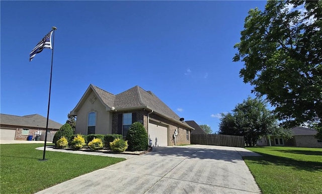 1109 Orlando Dr, Foley, AL 36535 - view of front of house featuring concrete driveway, brick siding, and a garage