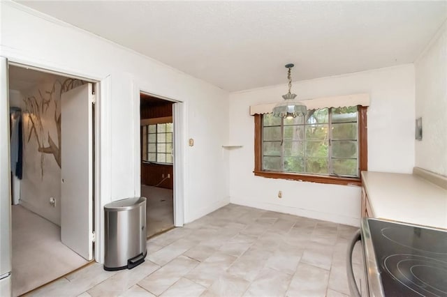 unfurnished dining area featuring a notable chandelier