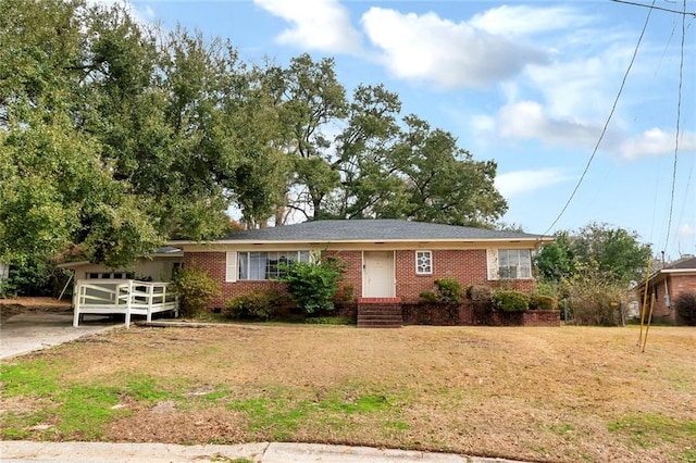 single story home with a garage and a front lawn