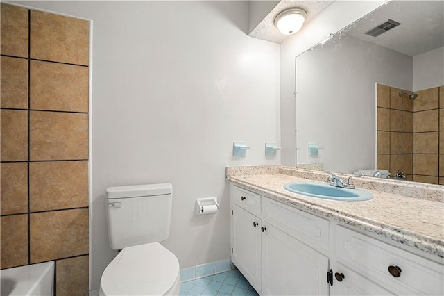 bathroom with walk in shower, vanity, toilet, and tile patterned flooring