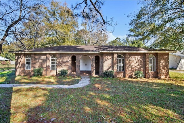 ranch-style house with a front lawn