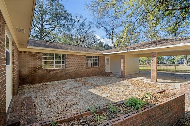 exterior space featuring a carport