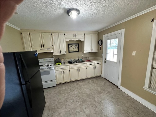 kitchen with black refrigerator, white range, a textured ceiling, ornamental molding, and light tile flooring