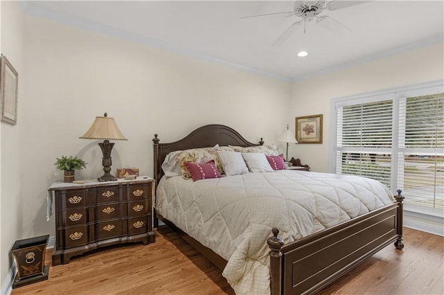 bedroom featuring crown molding, recessed lighting, wood finished floors, and ceiling fan