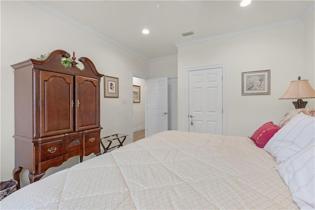 bedroom with visible vents, recessed lighting, and crown molding