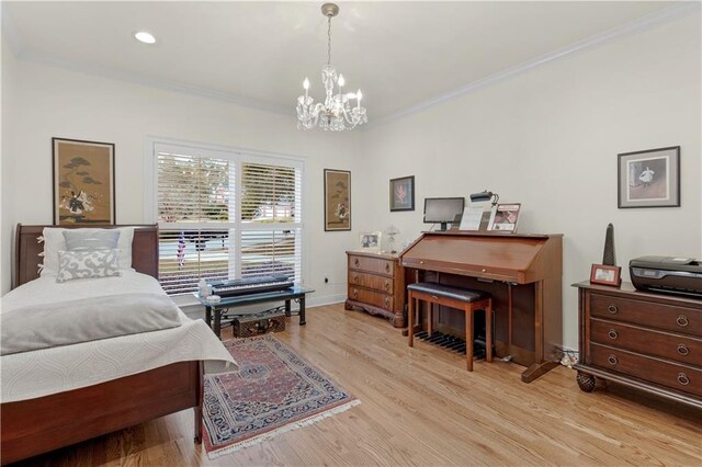 bedroom with a notable chandelier, ornamental molding, wood finished floors, recessed lighting, and baseboards