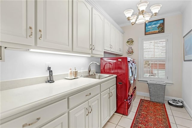 clothes washing area with independent washer and dryer, a sink, cabinet space, crown molding, and light tile patterned floors