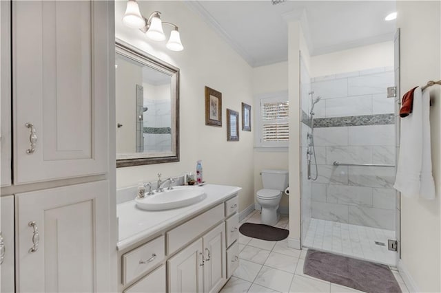 bathroom with crown molding, baseboards, toilet, a stall shower, and vanity