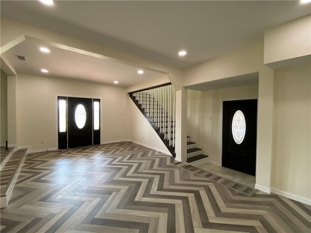 entryway with parquet flooring