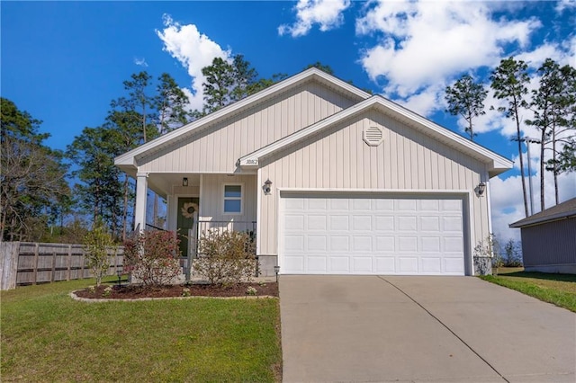 view of front of property featuring a front yard, an attached garage, driveway, and fence