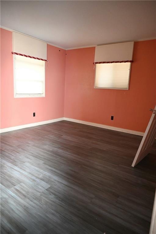 unfurnished room featuring dark wood-type flooring