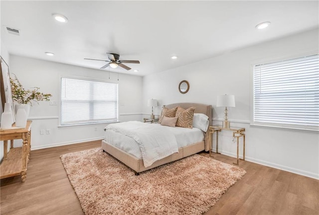 bedroom with visible vents, baseboards, ceiling fan, recessed lighting, and light wood-style flooring