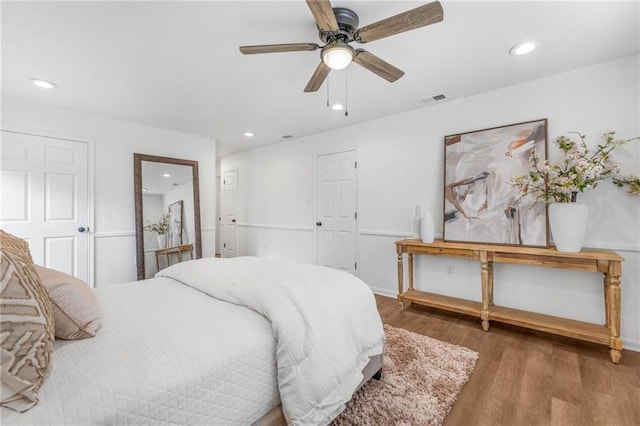 bedroom featuring recessed lighting, visible vents, and wood finished floors