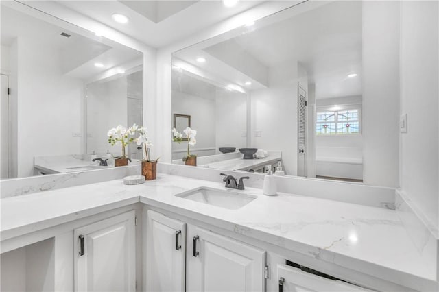 full bathroom with recessed lighting and vanity