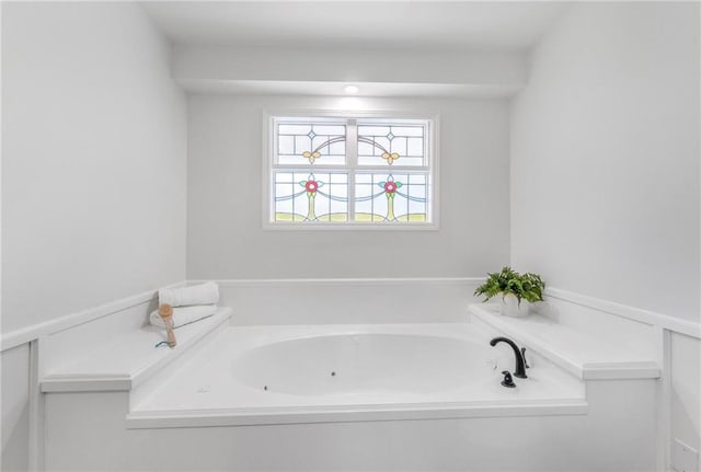 bathroom with a jetted tub