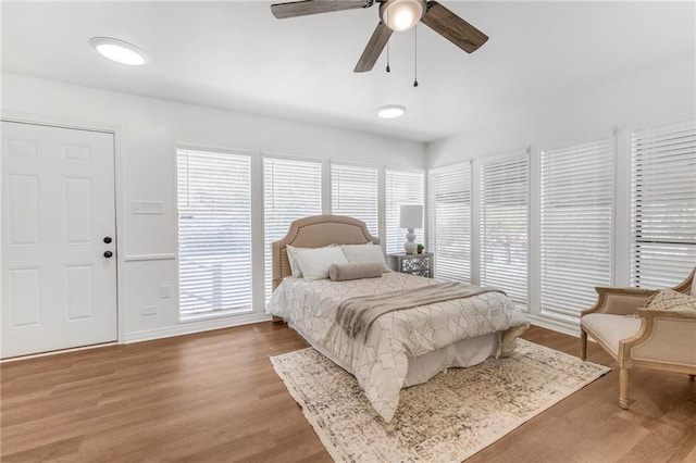 bedroom with ceiling fan and wood finished floors