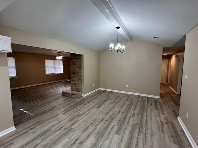 interior space with vaulted ceiling with beams, ceiling fan with notable chandelier, and light hardwood / wood-style flooring