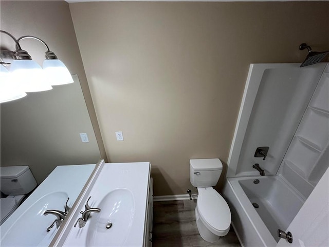 full bathroom with shower / tub combination, vanity, toilet, and hardwood / wood-style flooring