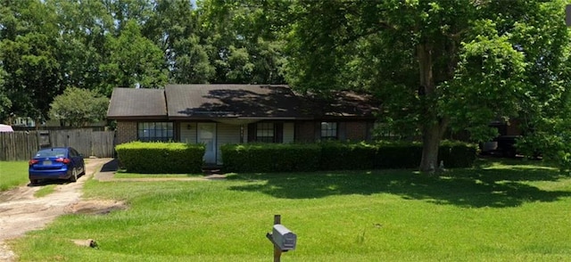 single story home with a front yard