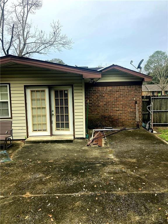 rear view of property featuring a patio