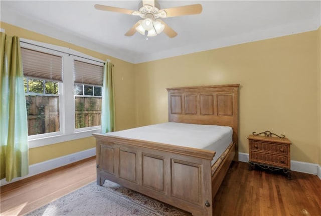 bedroom featuring ceiling fan and wood-type flooring