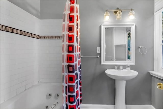 bathroom with shower / bath combination with curtain