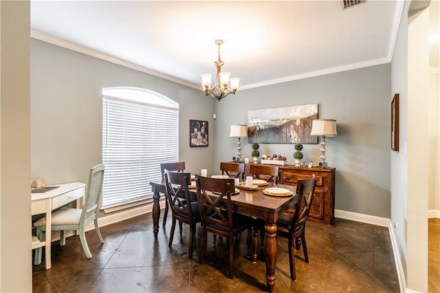 dining room with ornamental molding and a chandelier