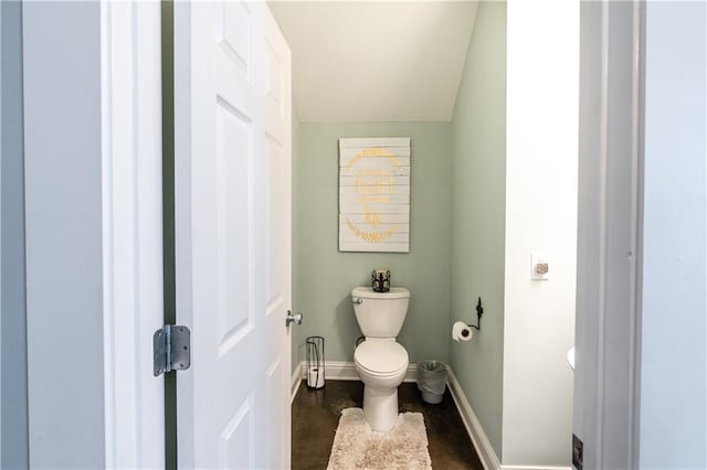 bathroom with vaulted ceiling and toilet