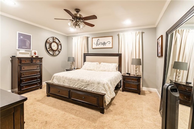 carpeted bedroom featuring ornamental molding and ceiling fan