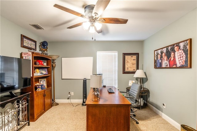 office area featuring ceiling fan and light carpet