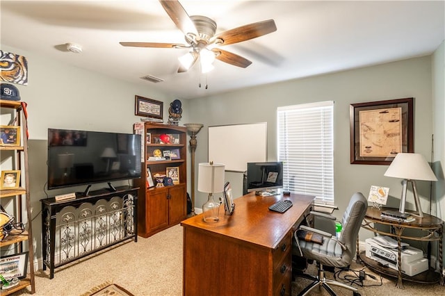 office with light carpet and ceiling fan