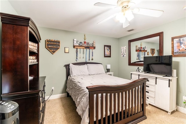 bedroom with light carpet and ceiling fan