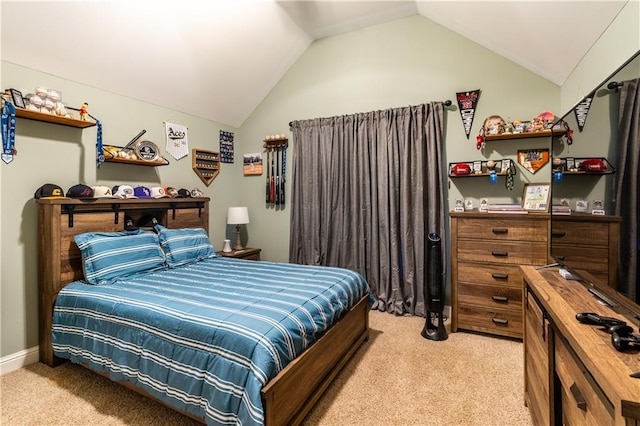 carpeted bedroom with vaulted ceiling