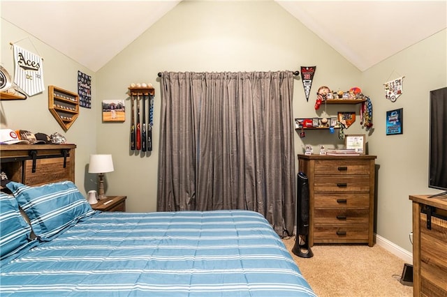 carpeted bedroom featuring lofted ceiling