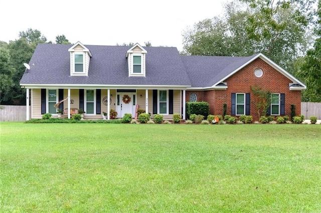 view of front facade with covered porch and a front yard