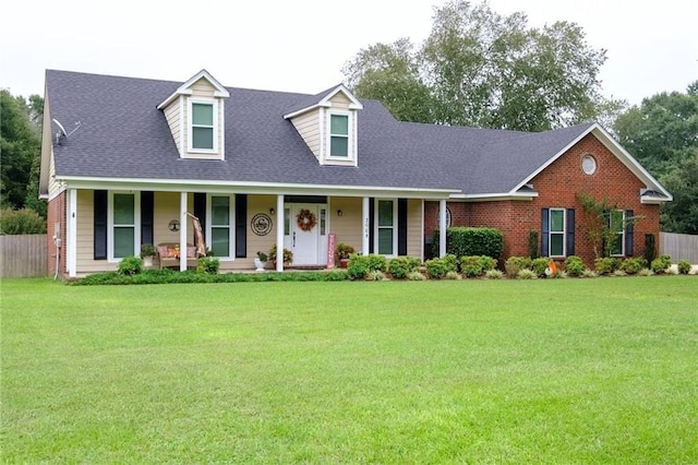 view of front facade featuring covered porch and a front lawn