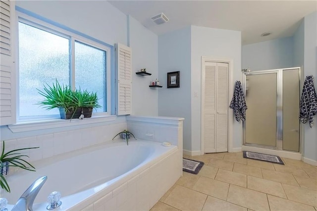 bathroom featuring shower with separate bathtub and tile patterned floors