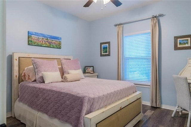 bedroom featuring ceiling fan and dark hardwood / wood-style flooring