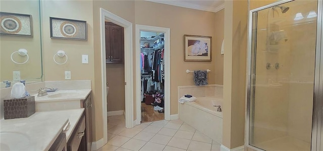 bathroom featuring shower with separate bathtub, vanity, tile patterned floors, and crown molding