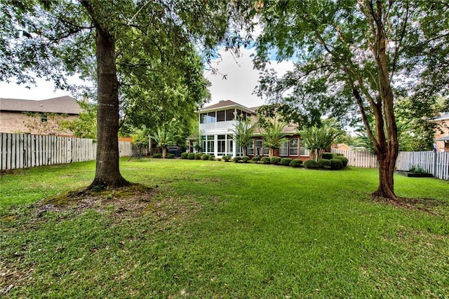 view of yard featuring a sunroom